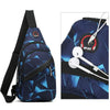 A navy blue waterproof crossbody chest bag with a black strap and a white wireless earbud attached.