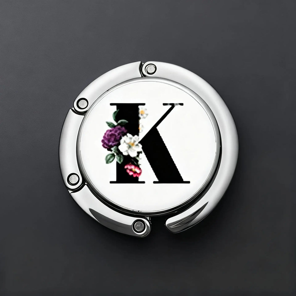 Silver foldable letter hanger hook with a black letter K design and floral accents