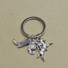 Silver keychain set featuring a cowboy boot, hat, and horse silhouette.