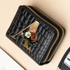 A black PU leather double-zip clutch wallet with a gold accent and a floral cartoon print.