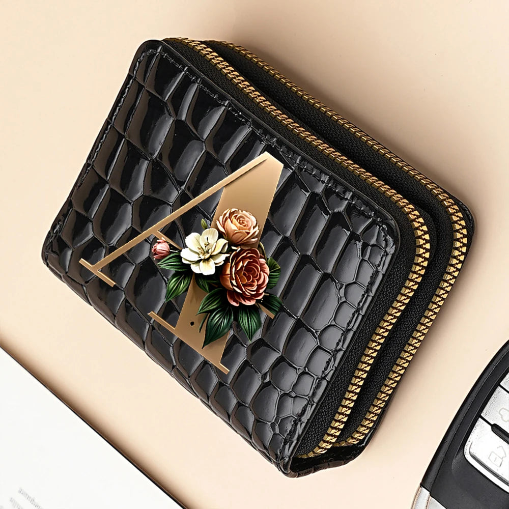 A black PU leather double-zip clutch wallet with a gold accent and a floral cartoon print.