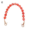 Handcrafted resin stone bead bag chain with round reddish-orange beads and gold clasps