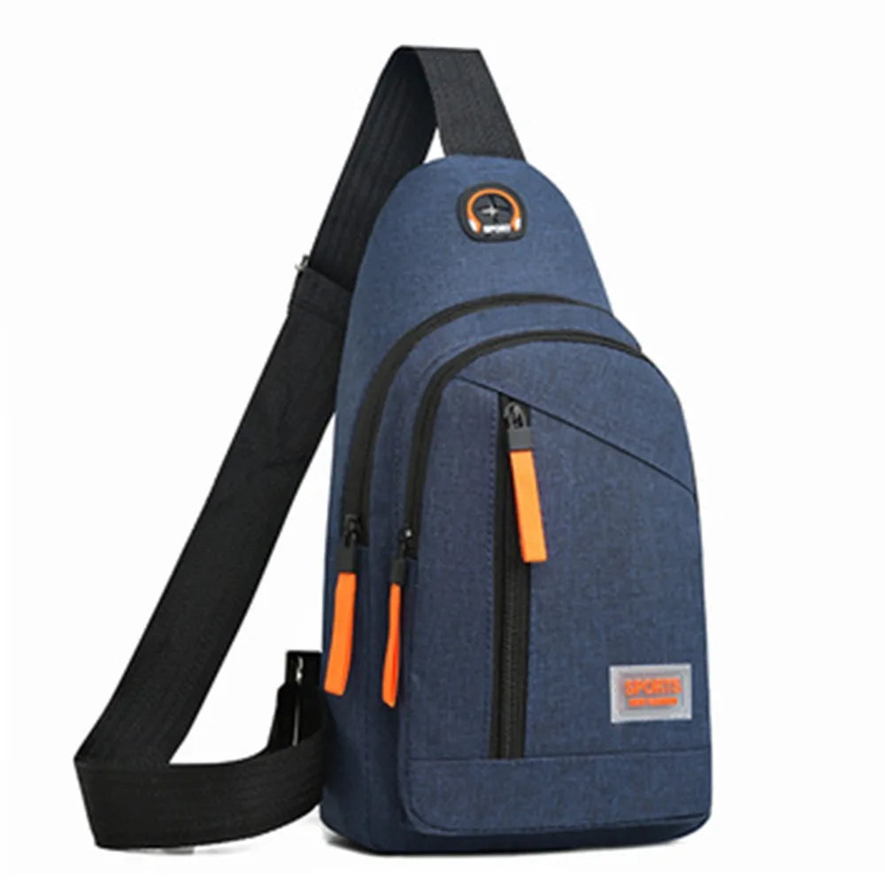 A navy blue lightweight oxford cloth crossbody bag with black strap and orange accents.