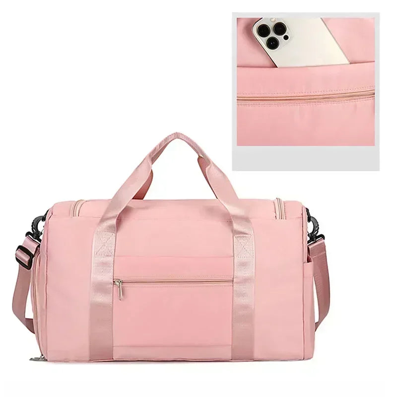 A pink large capacity travel duffle bag with a zipper and shoulder straps is shown next to a smartphone.