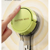 A hand is installing a silicone suction hook onto a smooth wall surface, demonstrating its use for hanging items.