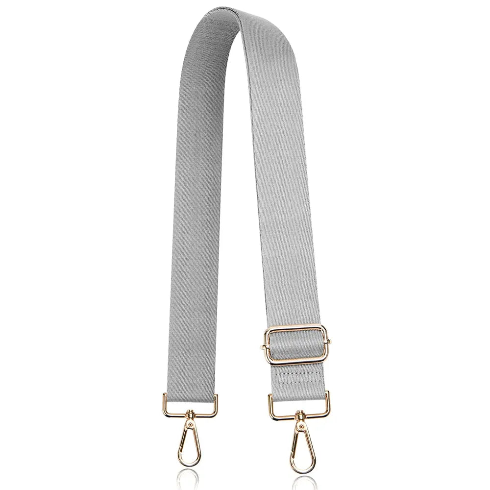 A gray nylon crossbody bag strap with a gold-toned buckle and adjustable slider.