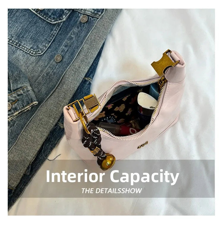 A pink retro PU leather shoulder bag is shown open, displaying its interior capacity and detailing.