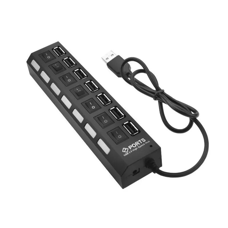 A black 7-port USB splitter hub with on/off switches and a cable.