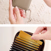 A close-up of a brown RFID shielded accordion wallet being held by hands.