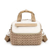 A beige quilted mommy bag with a light tan strap and a woven texture, shown from the front.