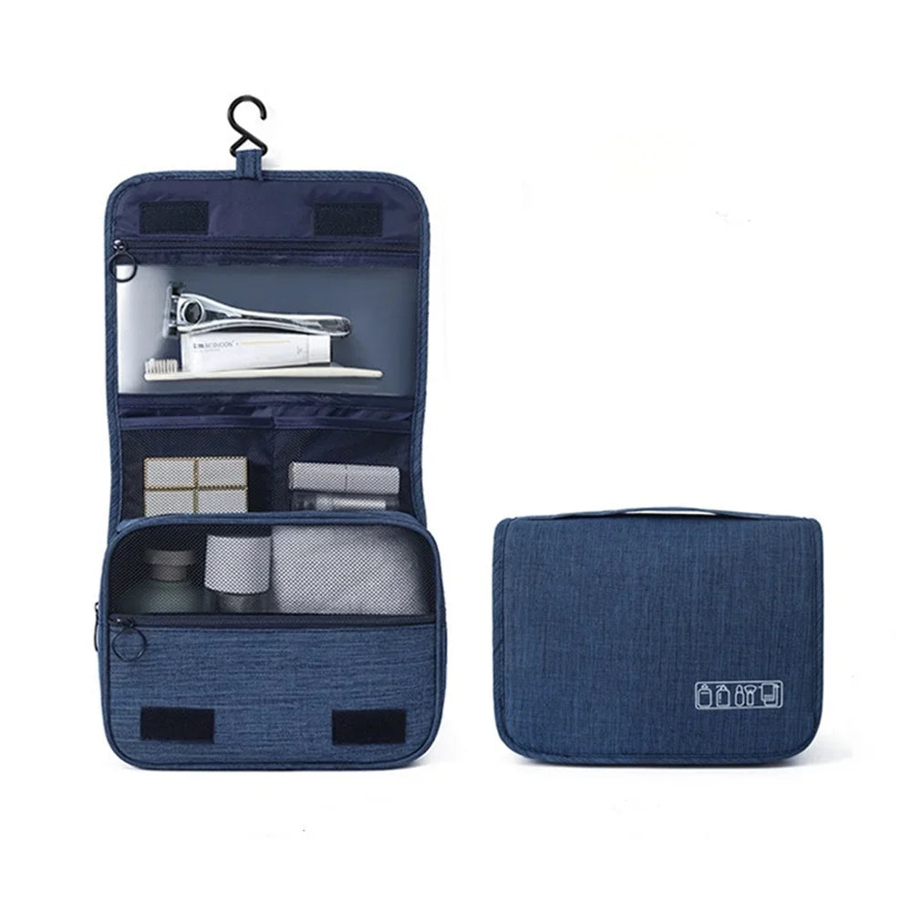 A dark blue portable waterproof toiletry washbag with a hanging hook, shown open and closed.