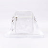 A clear transparent crossbody bag with an adjustable white strap displayed on a white surface.