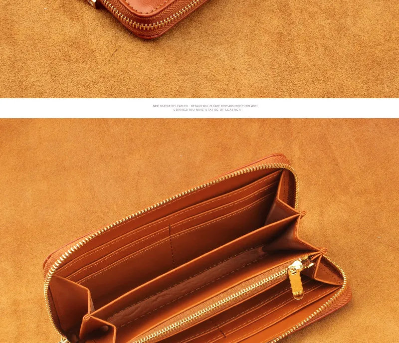 A brown genuine leather zipper wallet is shown open on a tan background.