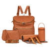 A tan leather backpack diaper bag with a front pocket and an attached pouch is shown.