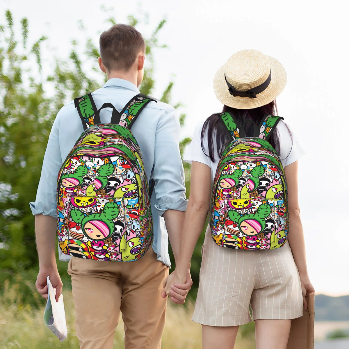 A person wearing a light blue shirt and tan pants is holding hands with another person carrying a colorful sport backpack.