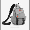 Sac de sport gris pour homme avec bretelles noires et accents orange.