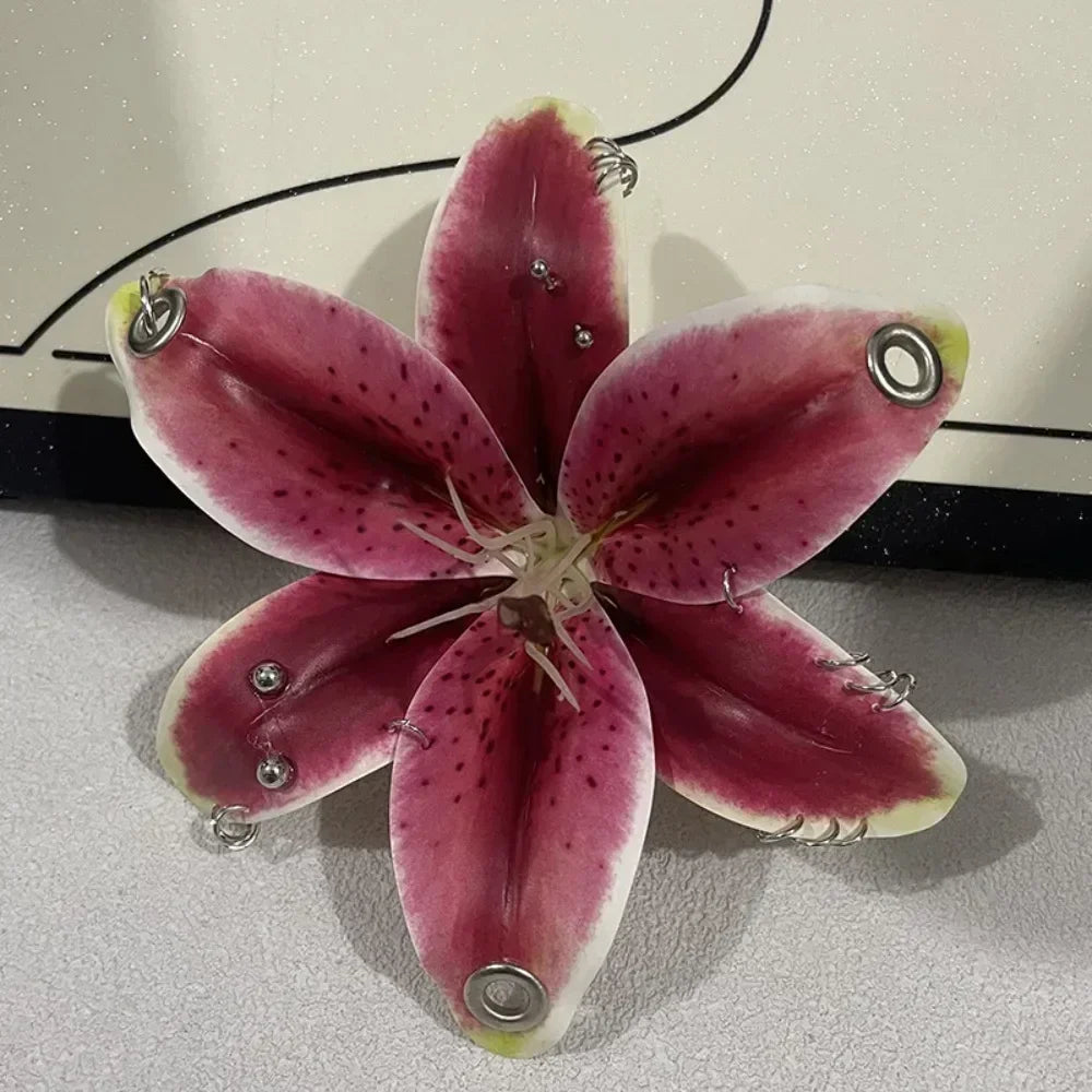 A realistic pink and magenta orchid flower is displayed against a light background.