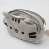 A soft gray storage pouch shaped like an anime cat face with stitched features and a zipper.