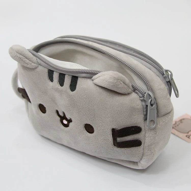 A soft gray storage pouch shaped like an anime cat face with stitched features and a zipper.