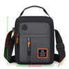 Black men's crossbody sling bag with an adjustable strap and a headphone port.
