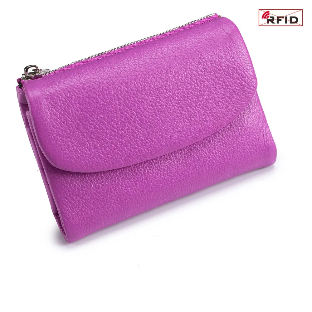 A purple genuine leather mini card holder wallet with a silver zipper.