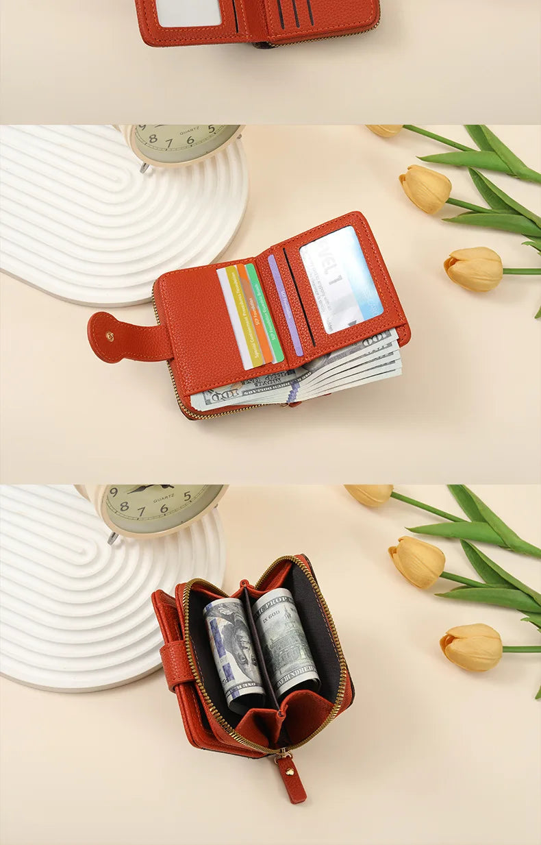 A brown leather compact wallet with a card slot and a zipper is shown next to a stack of cash and some dried flowers.