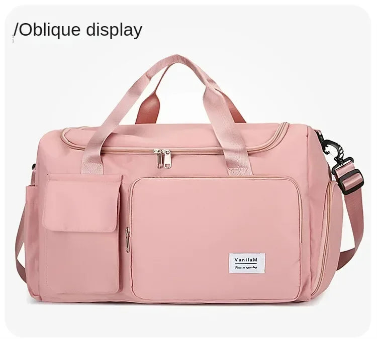 A pink large capacity travel duffle bag with an oblique display feature and shoulder straps.