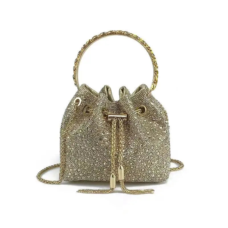 A gold crystal-embellished evening clutch bag with a chain strap.