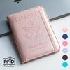 A pink RFID blocking PU leather passport holder with an eagle emblem and United States of America text.