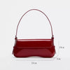 A maroon PU leather shoulder bag with an adjustable strap shown from the front.