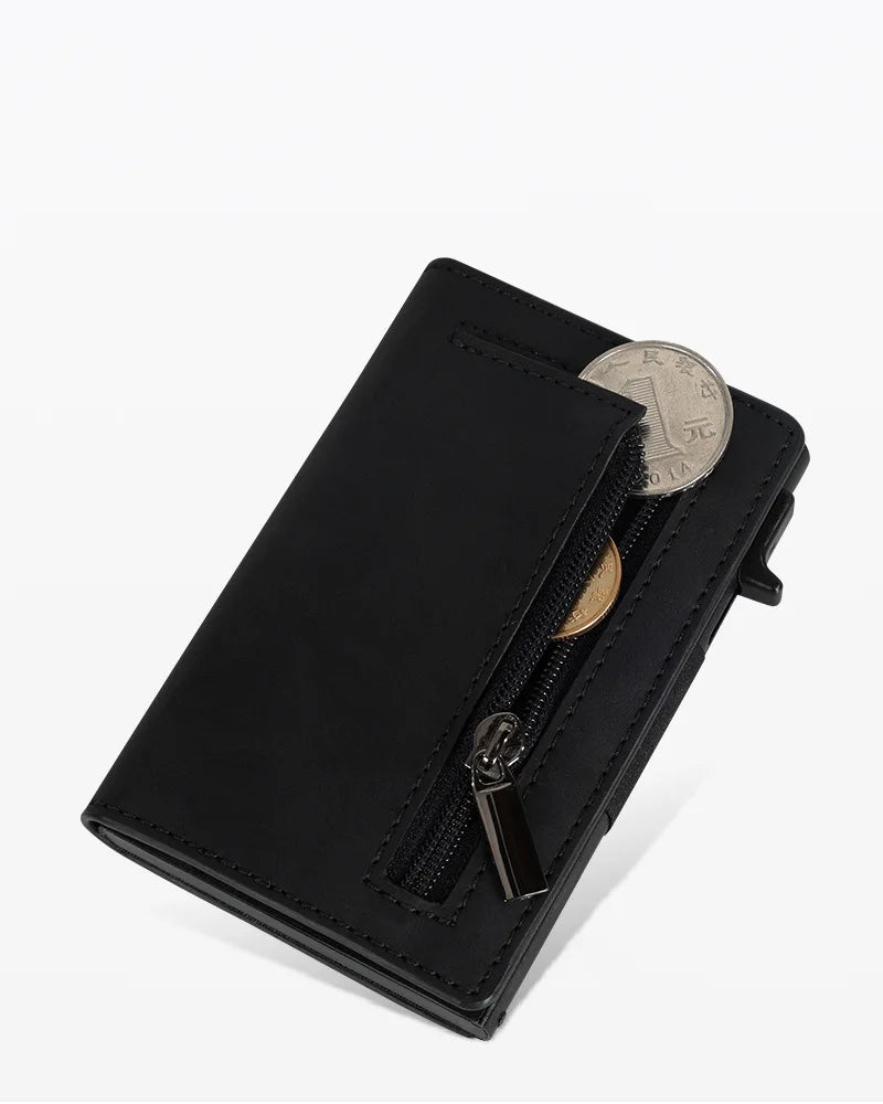 A black minimalist magnetic wallet for men with a gold coin visible through the transparent flap.
