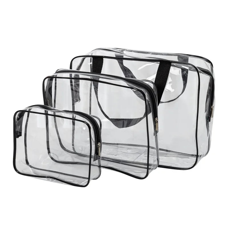 A set of three clear PVC travel toiletry bags with black straps.