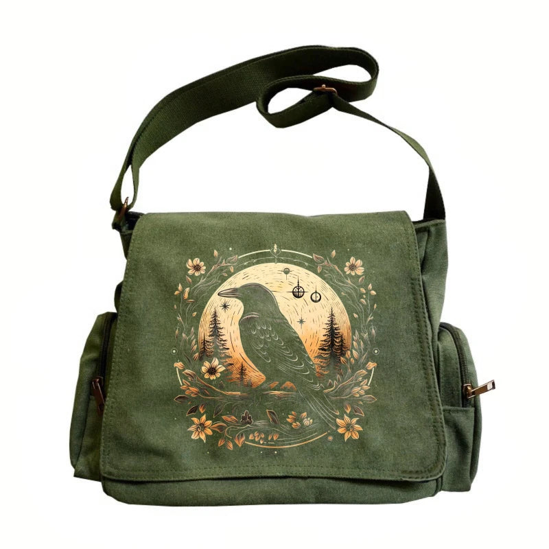 A dark olive green vintage canvas shoulder bag with a circular nature illustration featuring a bird and trees.