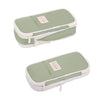 A light green pencil case with a white trim and a small tag is shown from above.