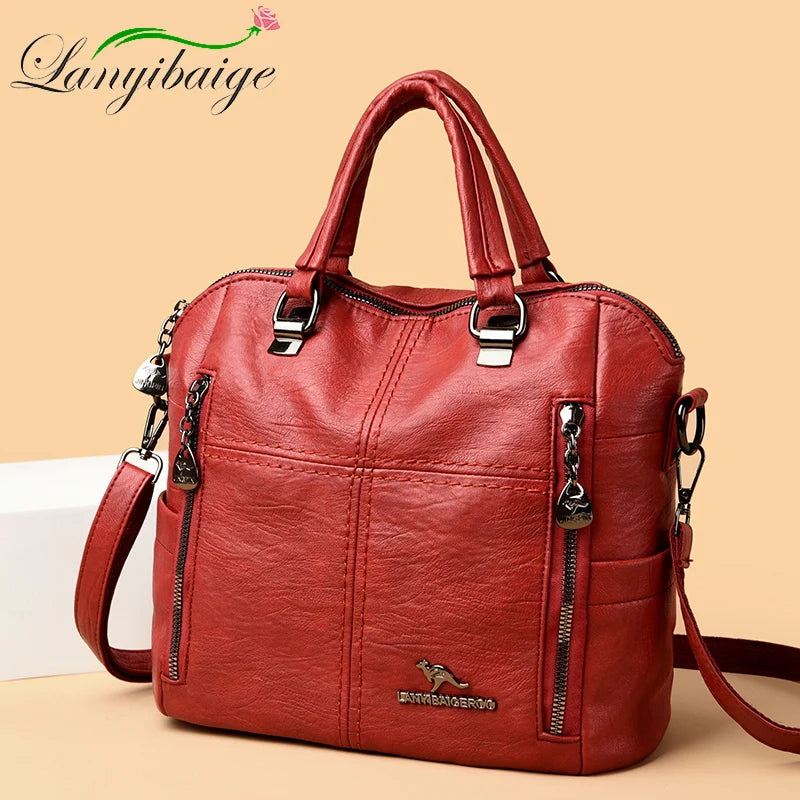 A reddish-brown leather fashion backpack bag with silver hardware shown in a studio setting.