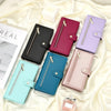 A collection of elegant leather crossbody phone cases in various shades including pink, purple, teal, and black displayed on 