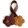 A handmade brown PU leather rose bag charm with a textured, layered design.