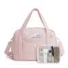 A pink expandable lightweight travel duffle bag with a zippered pocket containing various beauty and grooming products.