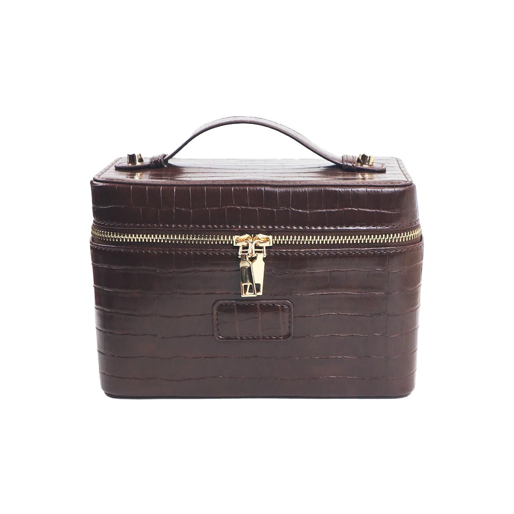 A dark brown PU leather makeup bag with a zipper closure and leather trim.