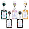 A set of five colorful badge reels with floral designs and ID cards on white holders.