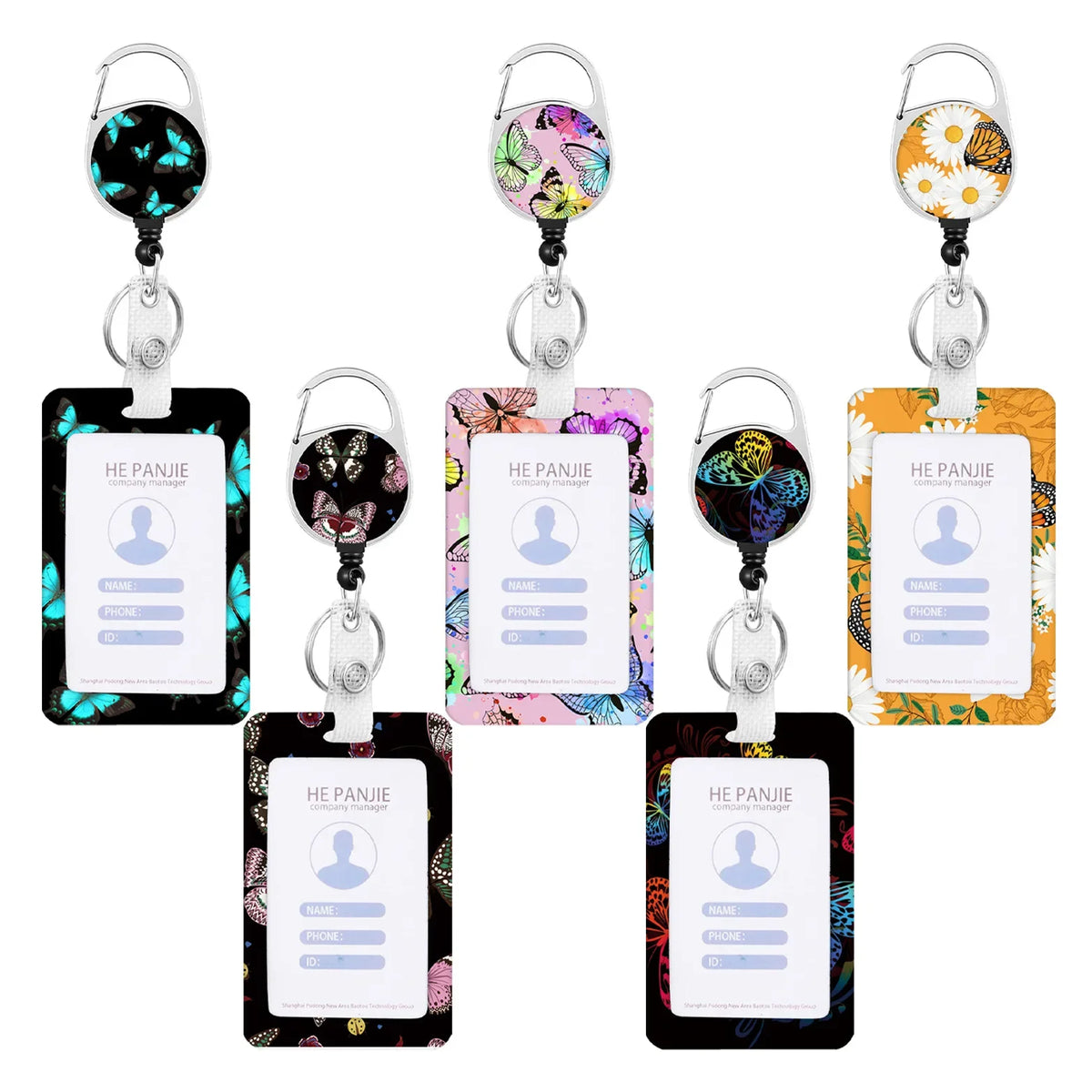 A set of five colorful badge reels with floral designs and ID cards on white holders.