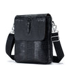 Schwarze Lederhandtasche mit Vintage-Krokodilmuster und schwarzem Riemen