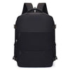 A black compact travel backpack with padded straps and multiple compartments.