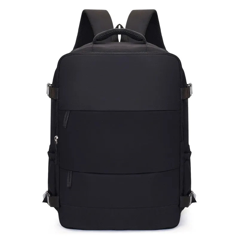 A black compact travel backpack with padded straps and multiple compartments.