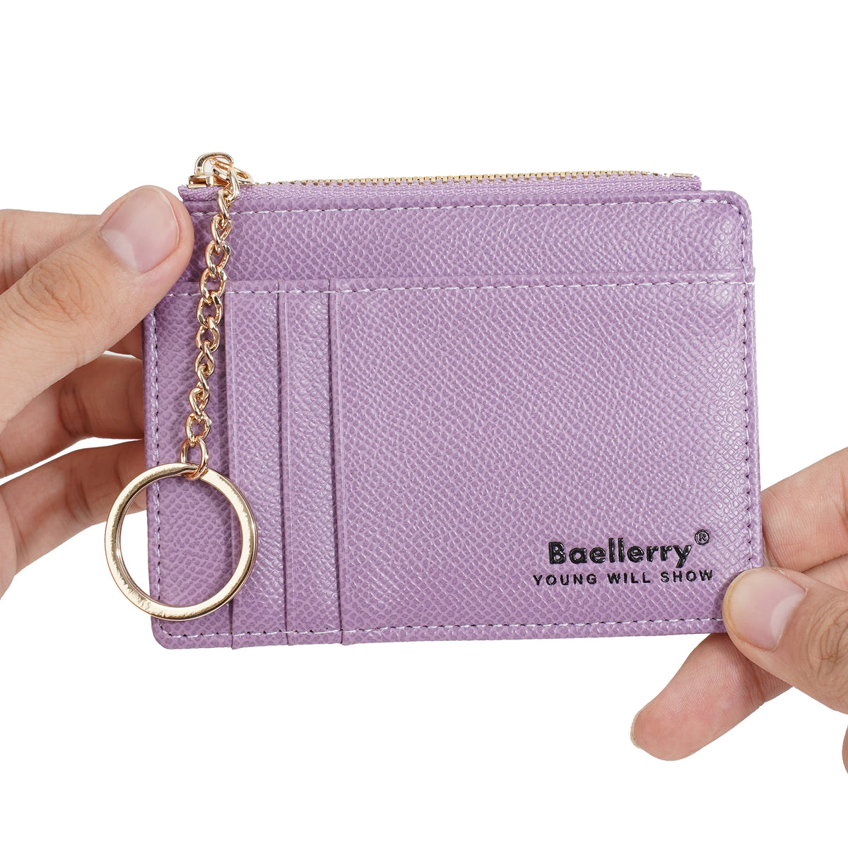 A purple leather card holder wallet with a gold chain attached, shown being held by a hand.