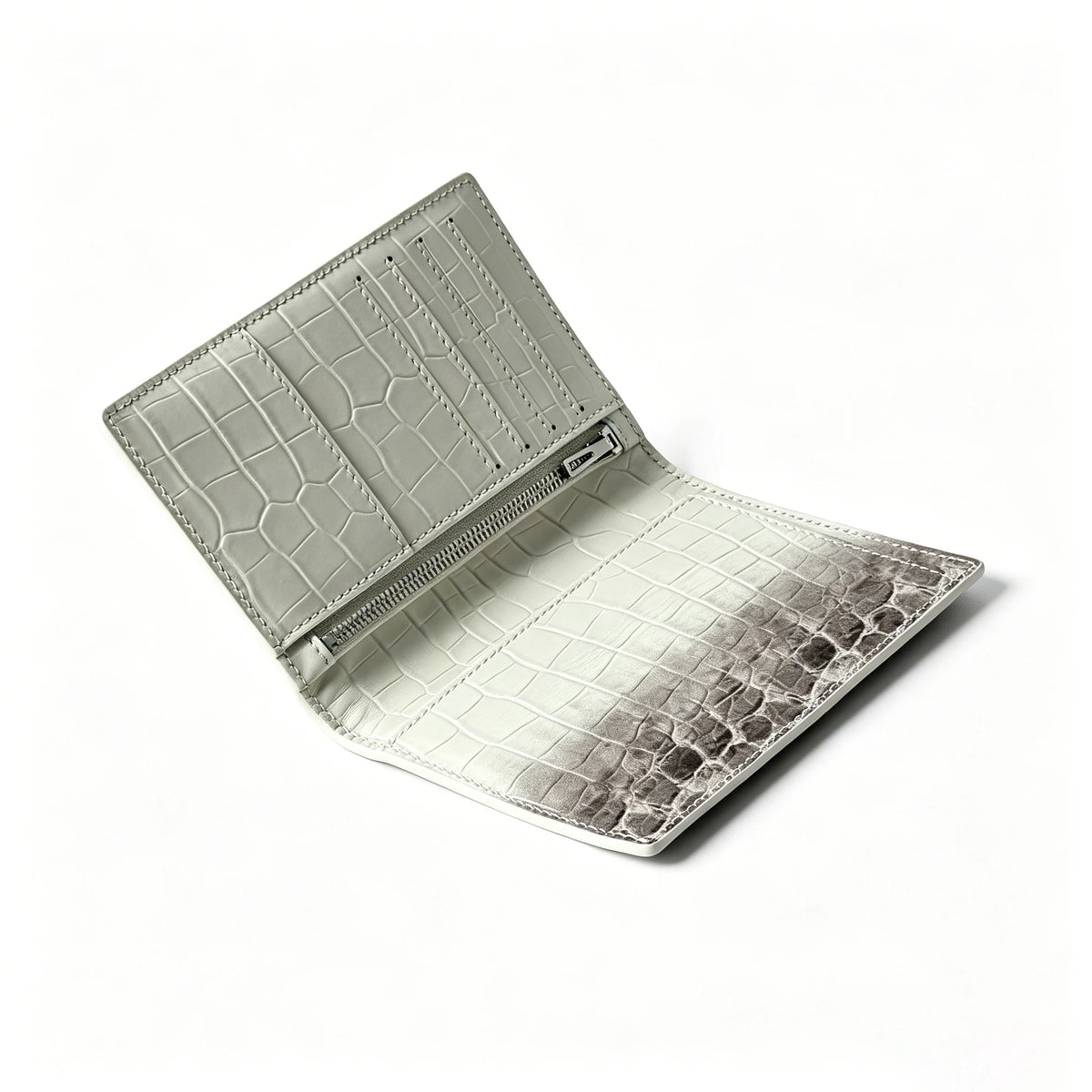 A silver-toned genuine leather passport holder featuring a crocodile pattern and custom initials.