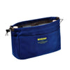 A navy blue drawstring canvas storage organizer bag with a brown lining and a small tag.