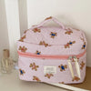 A pink and white striped cosmetic makeup bag featuring bear designs.