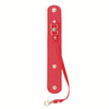 A red vintage leather glove holder strap with a metal clasp and leather accents.