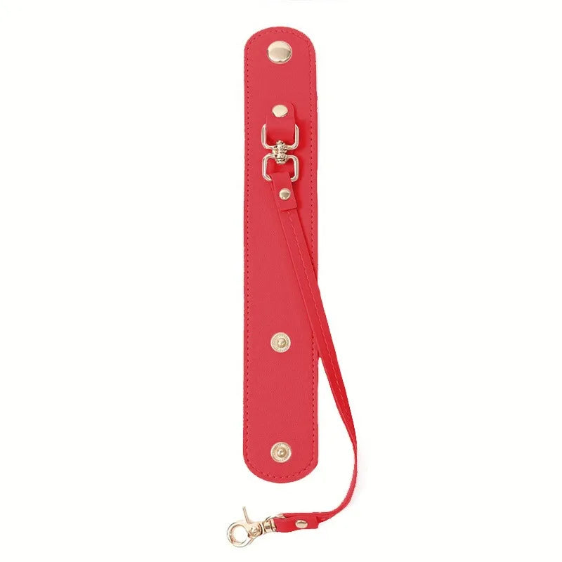 A red vintage leather glove holder strap with a metal clasp and leather accents.